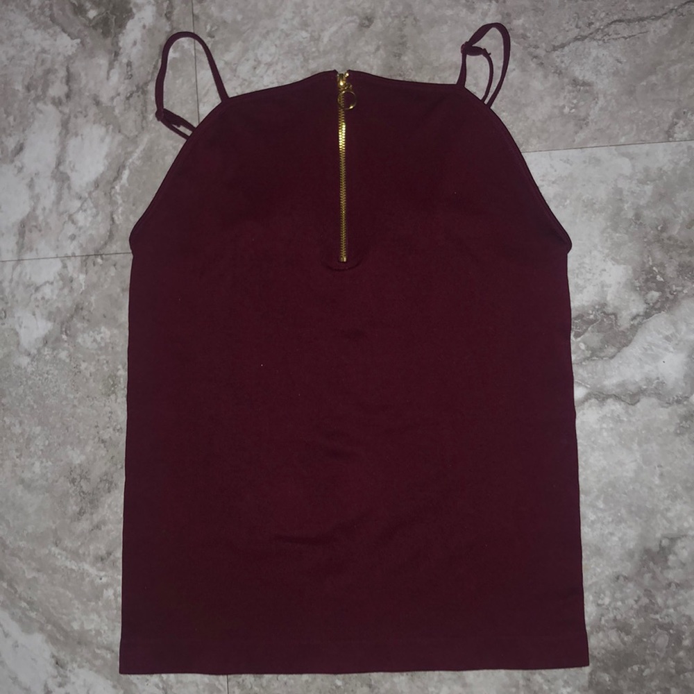 burgundy top.